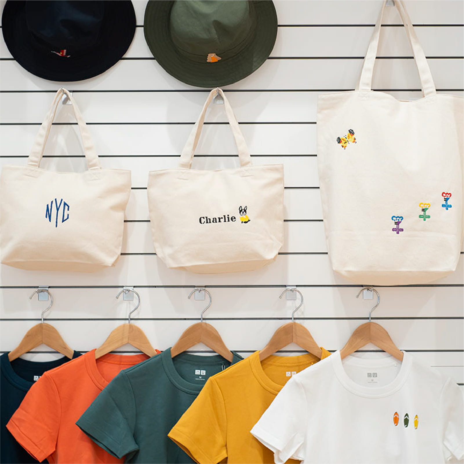 Brother commercial embroidery machine demonstrating versatility – embroidering on various fabrics, textures, and different positions on bags including handles, corners and sides