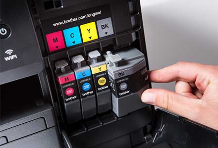 Brother Black ink cartridge being inserted to a printer