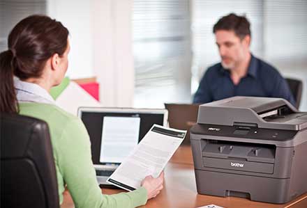 A Brother Printer in the foreground - Improve Productivity and Save Time